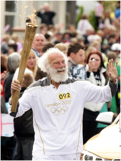 Mike Lapage carrying the Olympic torch 2012